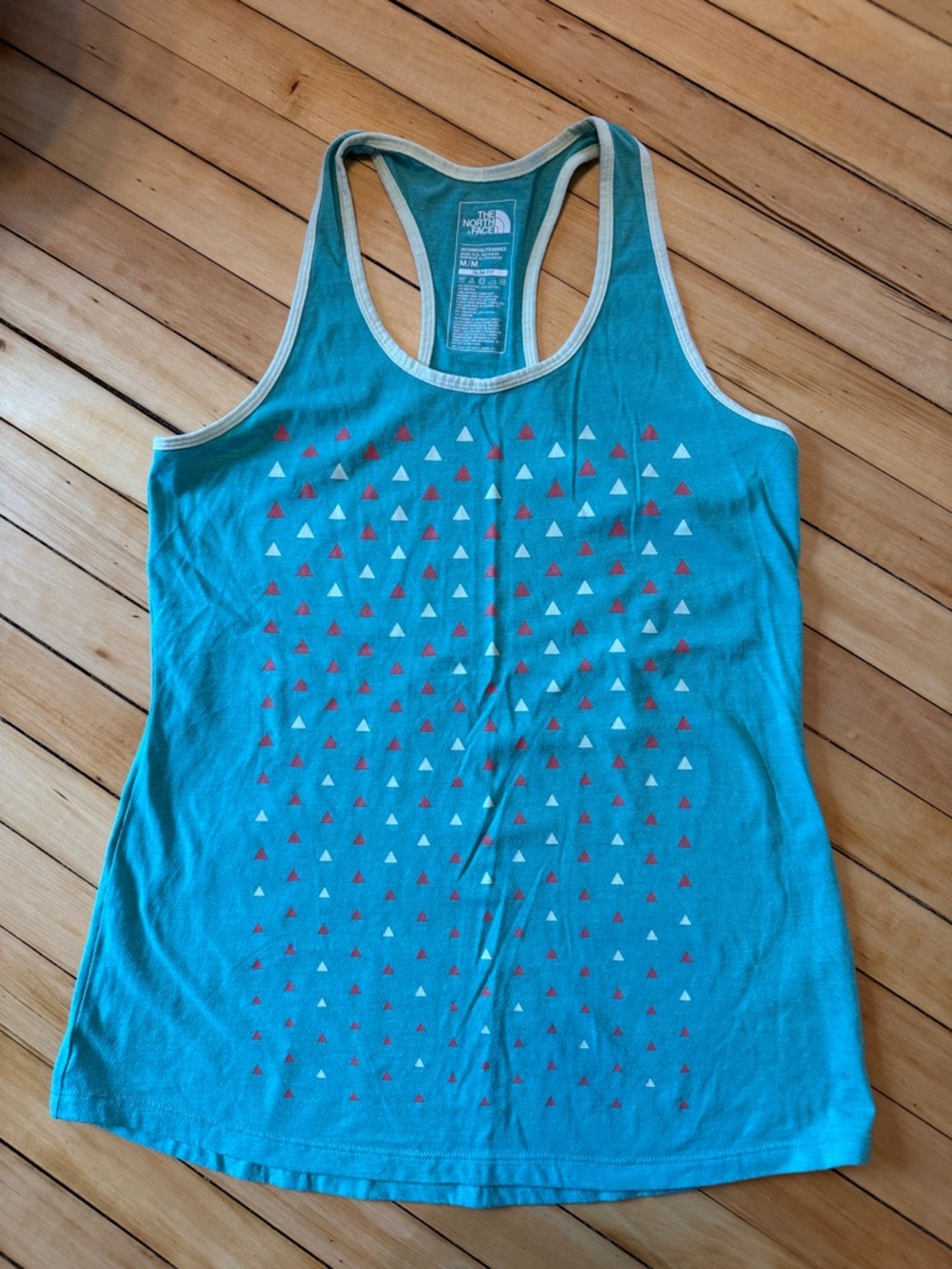 The North Face Teal Racerback Tank with pink and cream Triangle Pattern